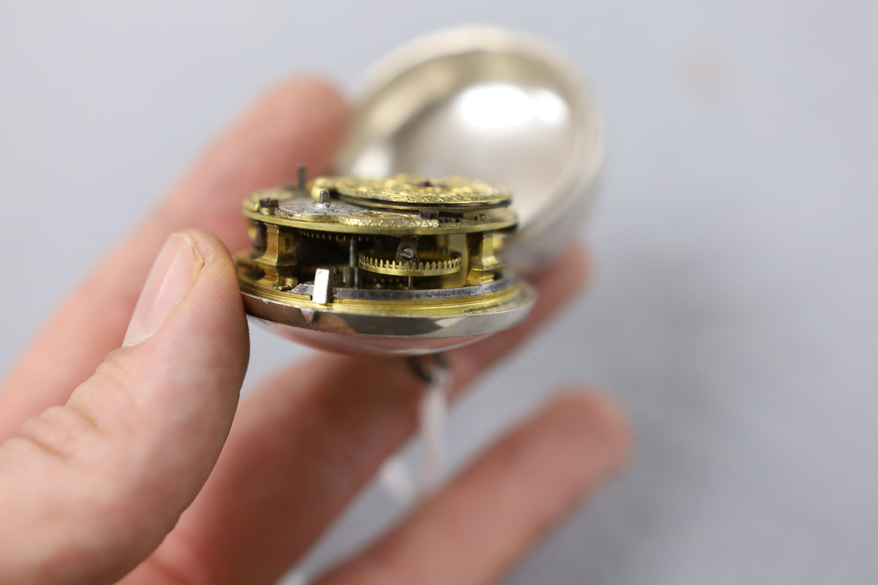 An 18th century white metal pair cased keywind verge pocket watch, by Isaac Soret, cased diameter 51mm